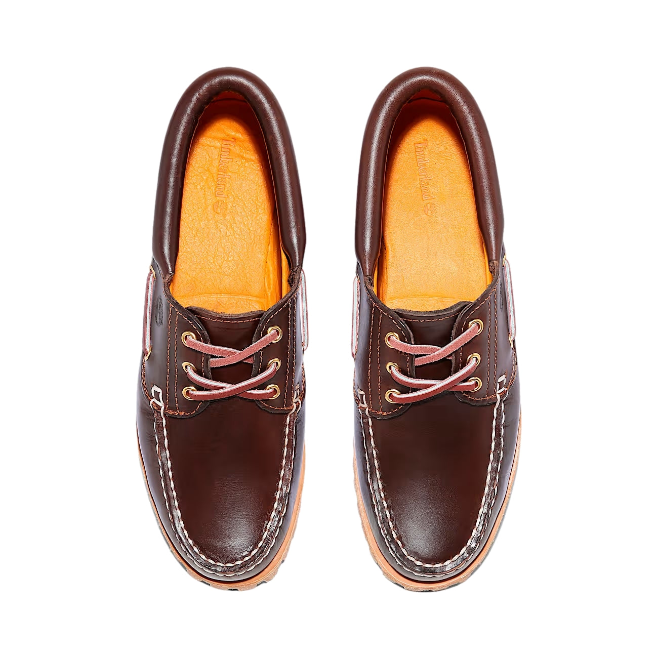 Brune Timberland Noreen båt sko med lærrem og hvit såle, vist fra siden. Klassisk og komfortabelt design for sommerbruk.
