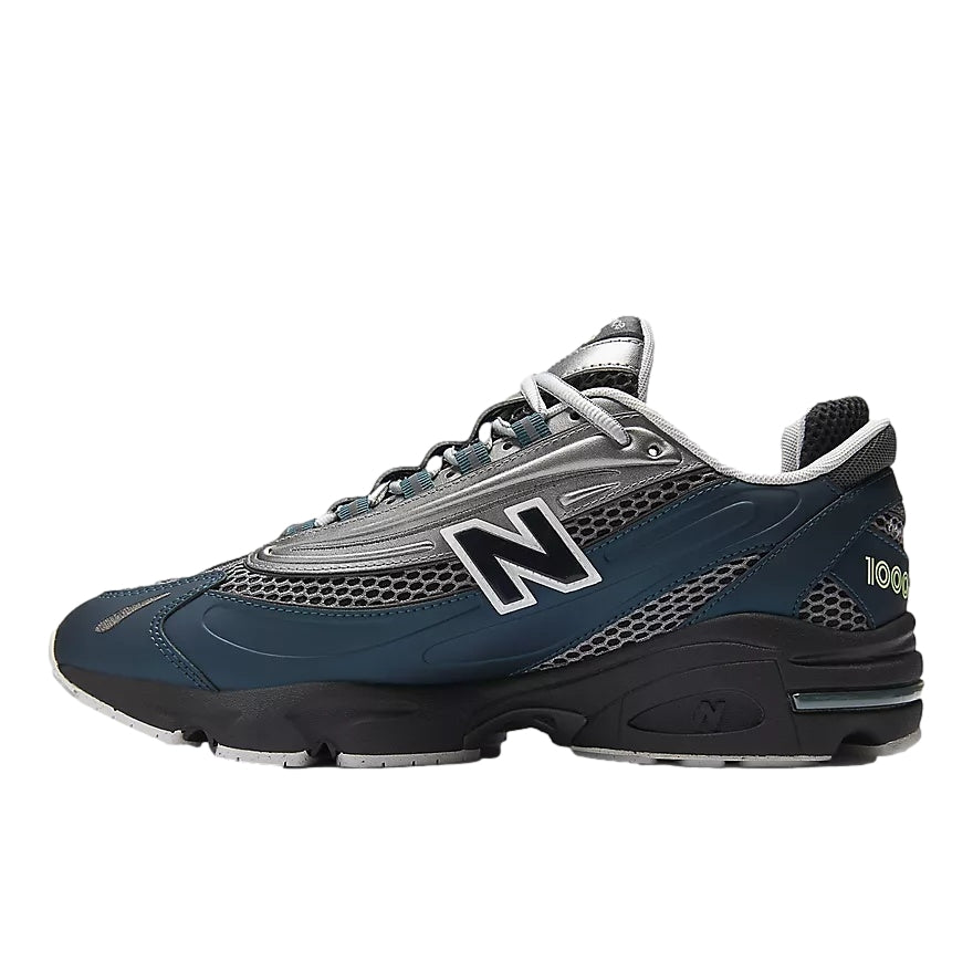 Blå og grå New Balance M1000S sportssko med komfortabel design og luftige materialer, vist i bilde.