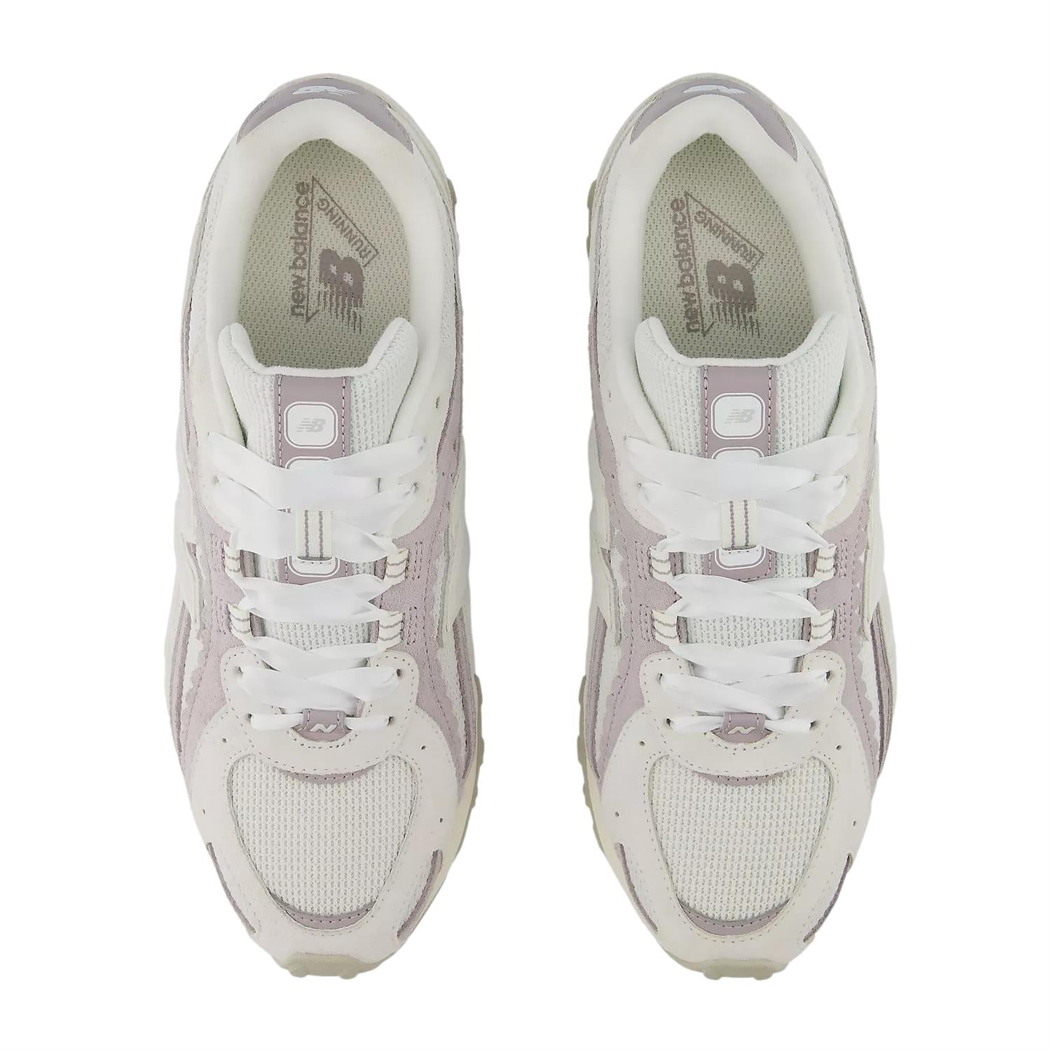Lilla og grå New Balance 204L 6A6 Reflection sko med reflekterende detaljer for trening og utendørsbruk.