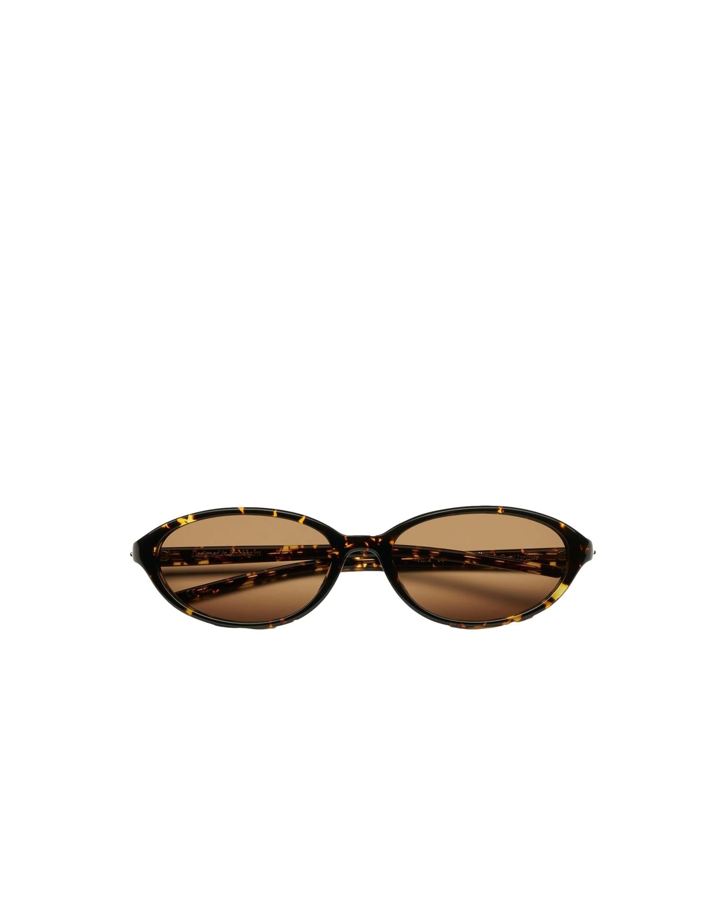 Chimi Eyewear solbriller med ellipseform, tortoise-mønster, brune glass og ramme, elegant og moderne design