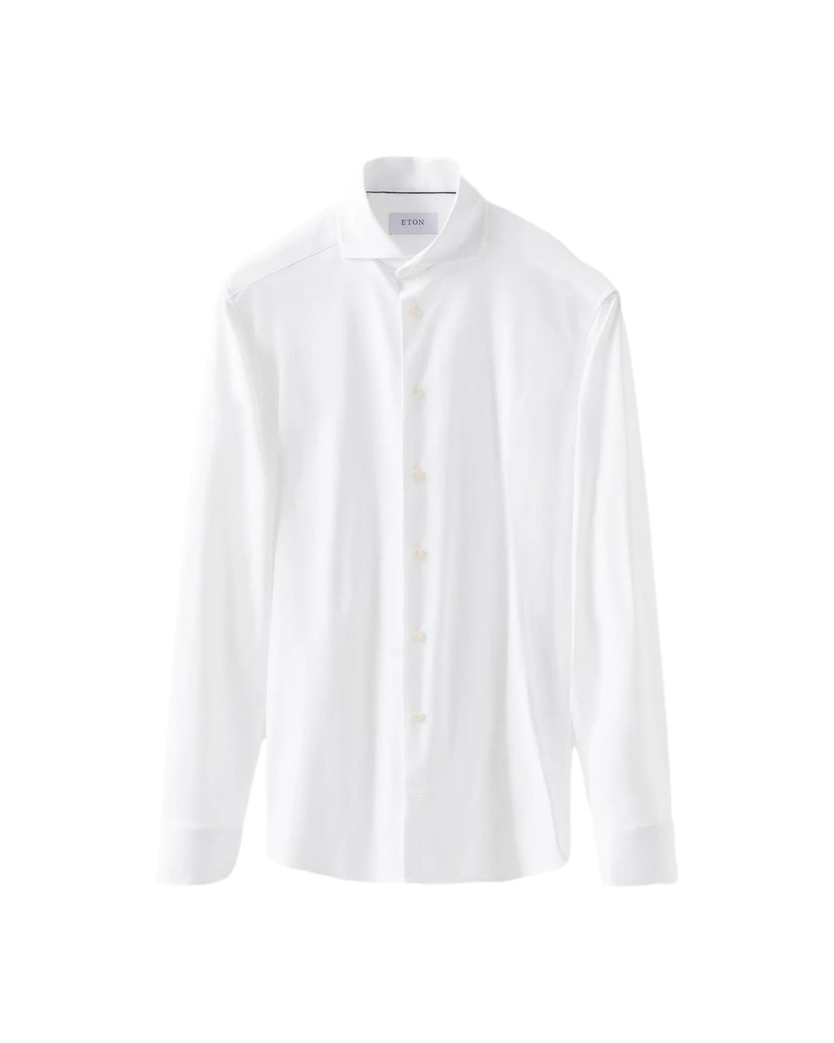 Hvit Eton skjorte i semi-solid fireveis stretch med knappestolpe og klassisk krage, vist lagt flatt.