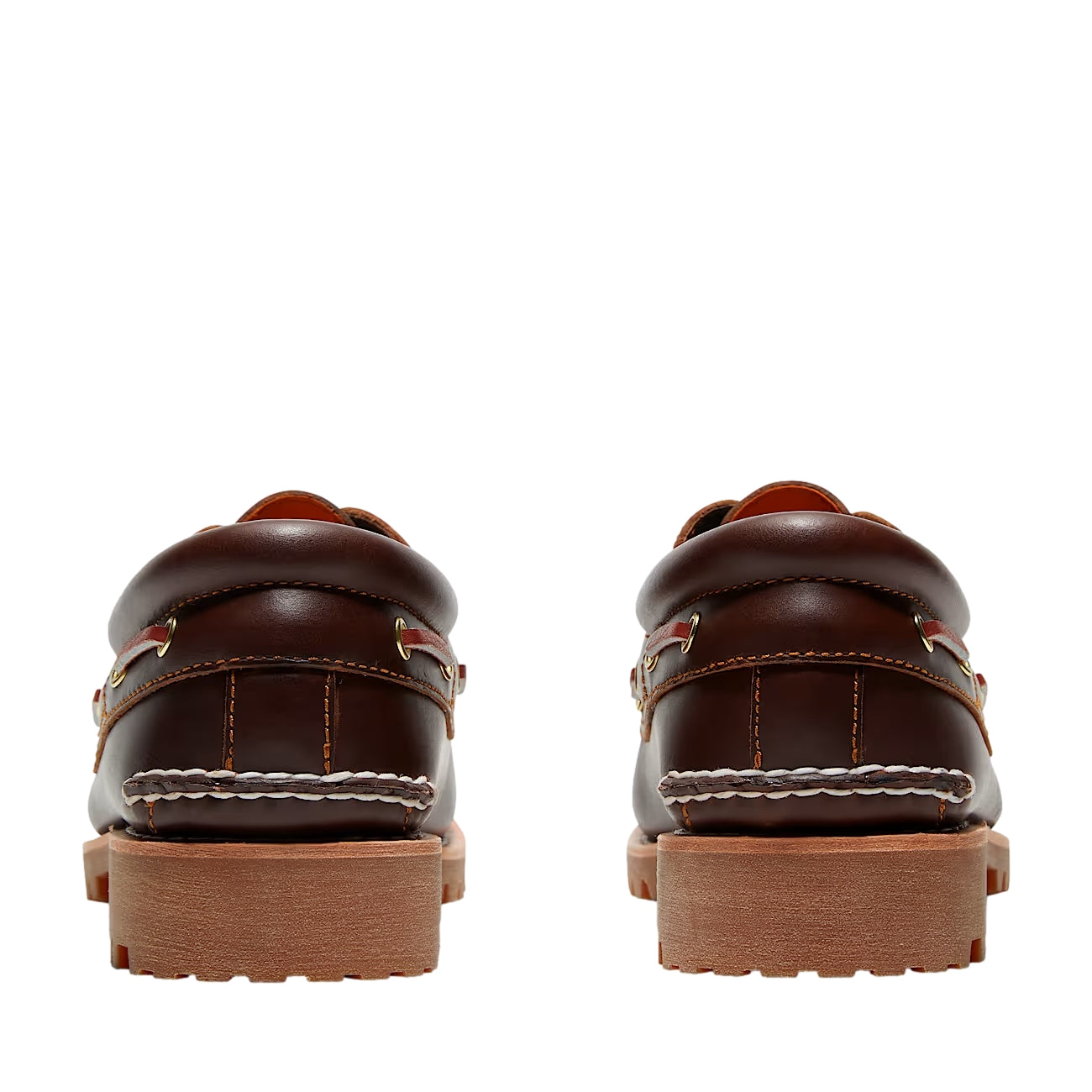 Brune Timberland Authentic 3-Eye Lug båtsko med lærrem og gummisåle, vist på en flat overflate.