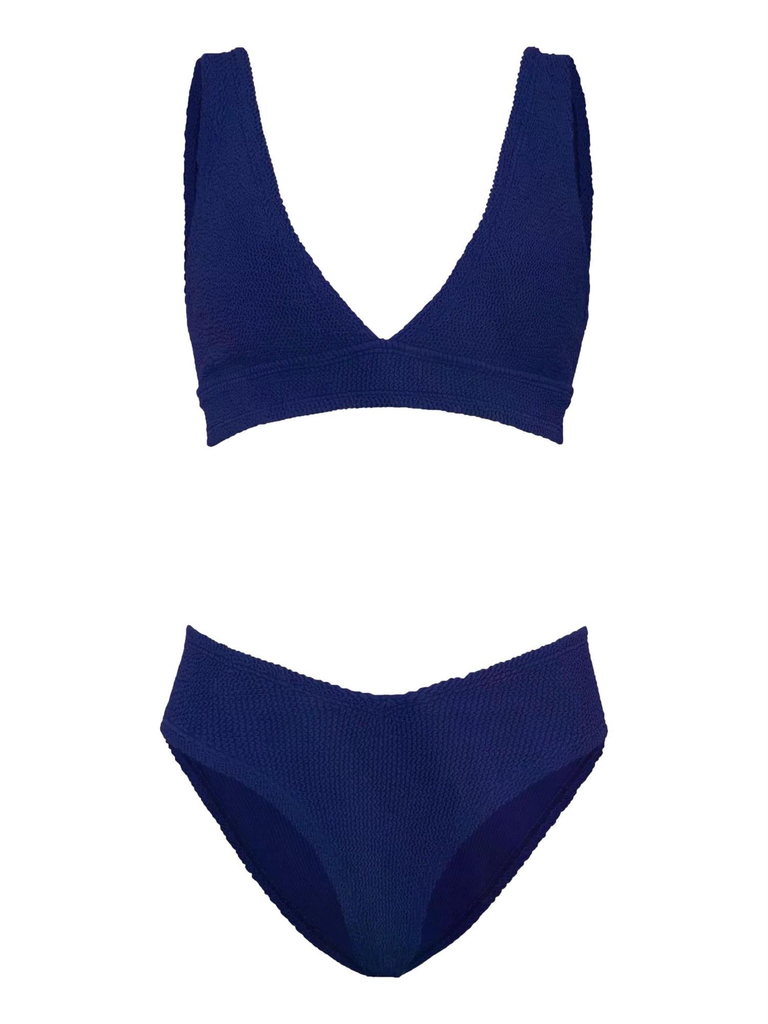 Hunza G Angel bikini i marineblå med glatt, elastisk stoff, vist på modell foran hvit bakgrunn.