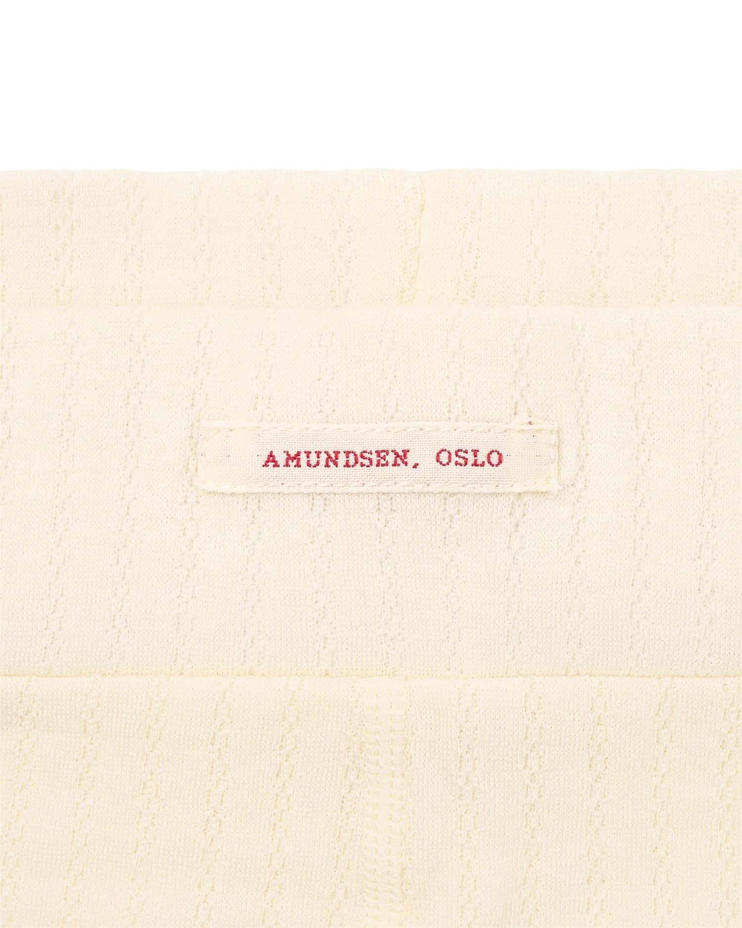 Amundsen Hero's Hide Long Janes ullundertøy for kvinner i off-white, varm og komfortabel baseplagg i ullmateriale.