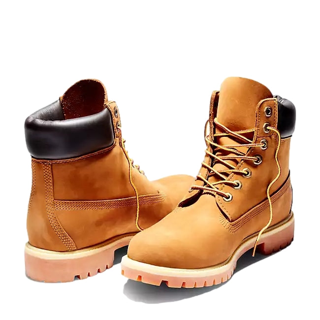 Timberland 6-tommers premium støvel i gul skinn, vises med robust såle og klassisk design, perfekt for utendørs bruk.