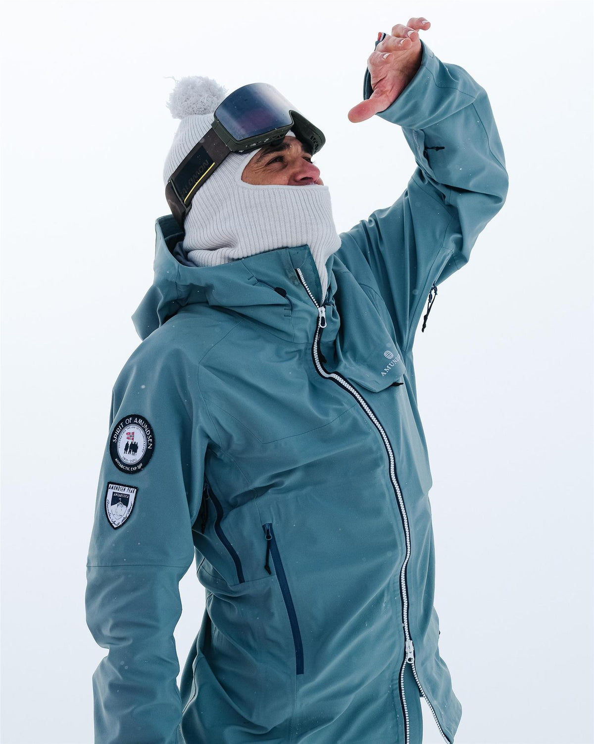 Amundsen Peak Jakke til menn i Stormy Blue, turkis, med mykt materiale og værbestandig design for utendørsbruk.