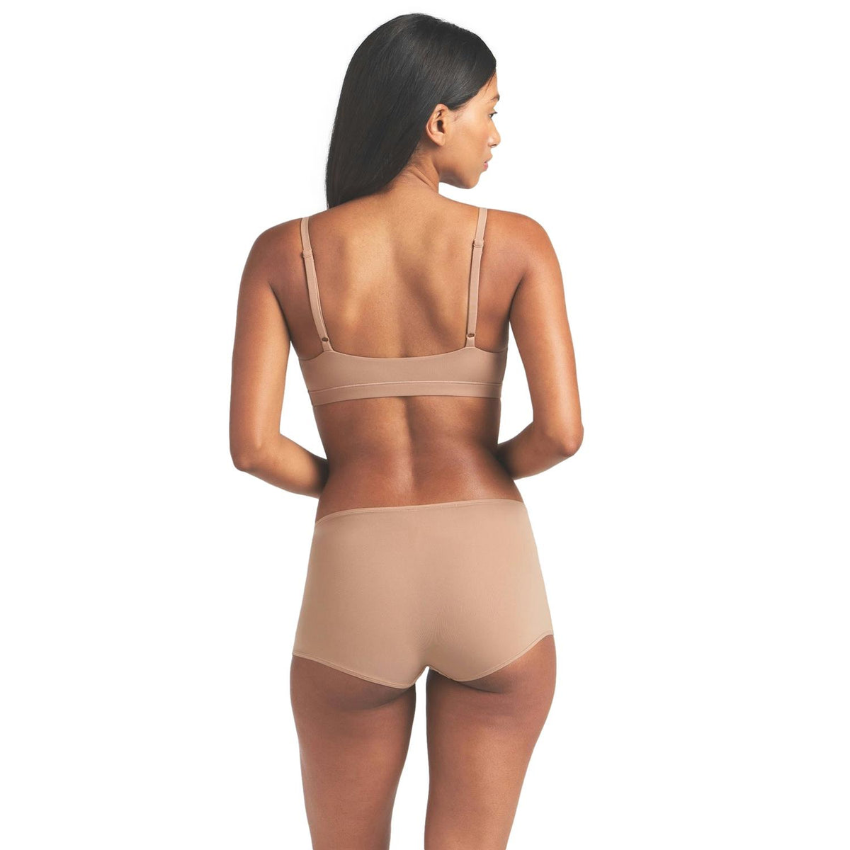 SKIMS Fits Everybody Scoop Bralette i brun/beige, komfortabelt undertøy med mykt design, vist på en person.