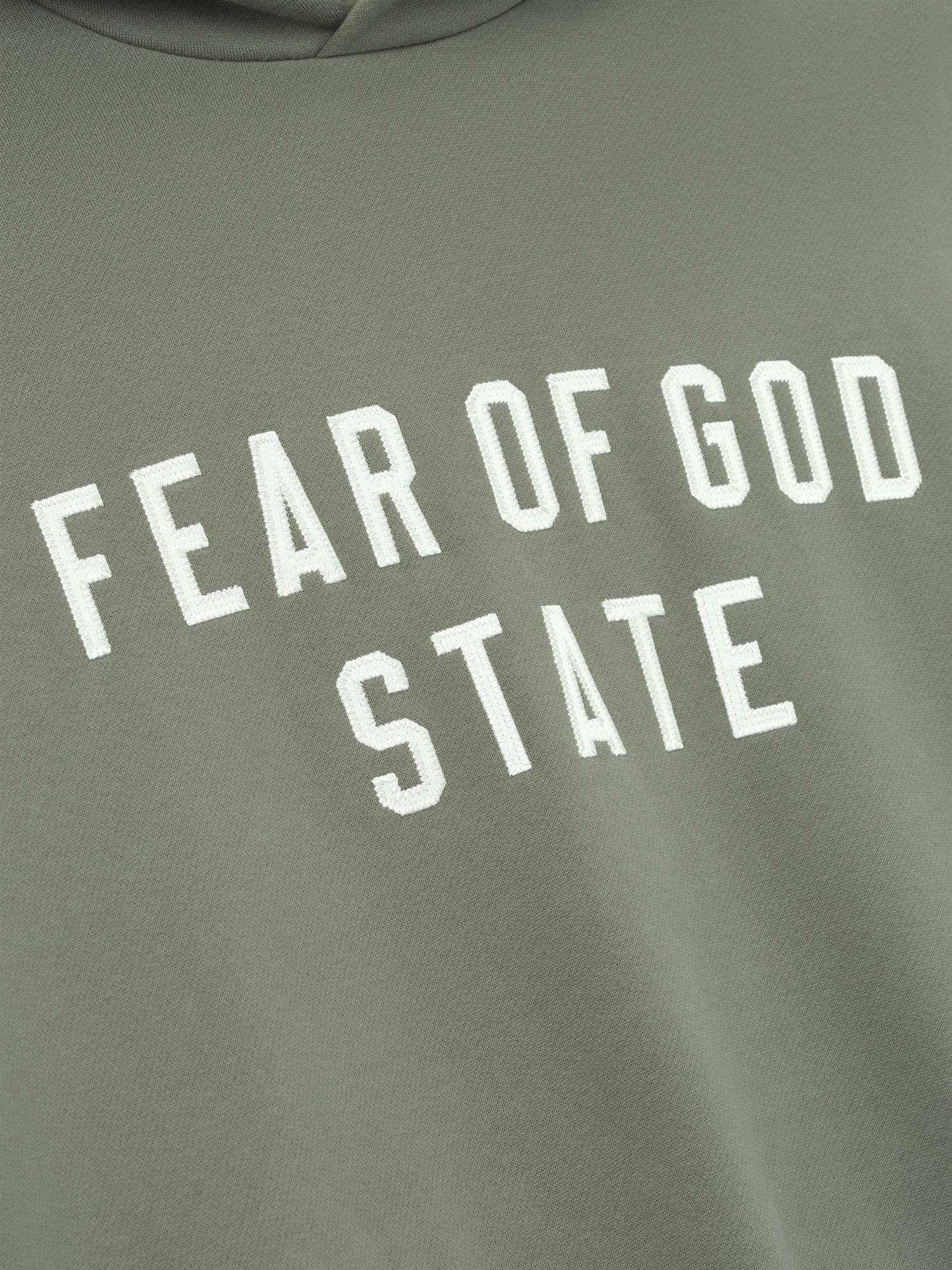 Fear of God Essentials 90S Fit Fleece Hoodie Hettegenser Lysebrun - modostore.no