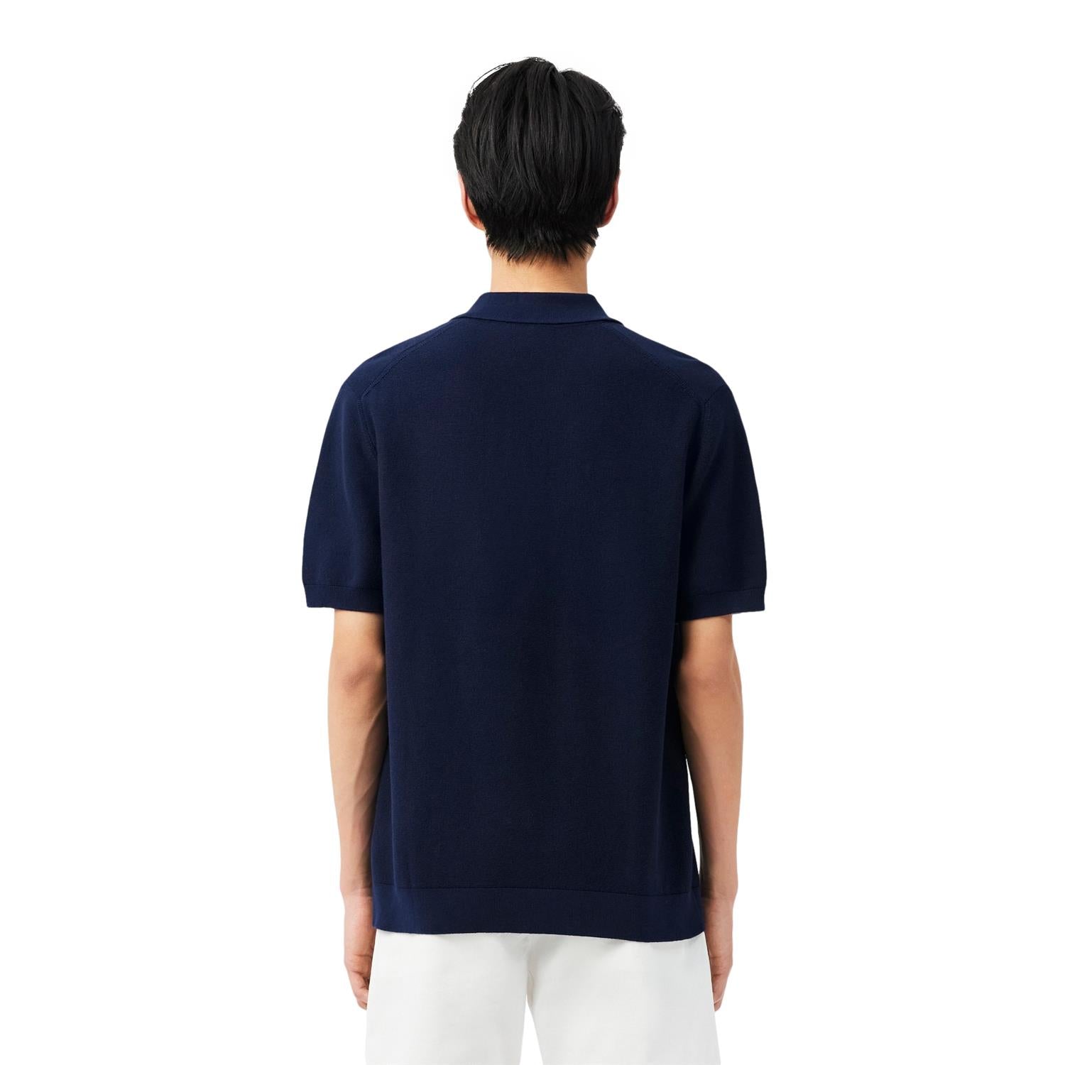 Lacoste klassisk passform strikket polo T-skjorte i marineblå med krage og knapp, laget av mykt stoff.